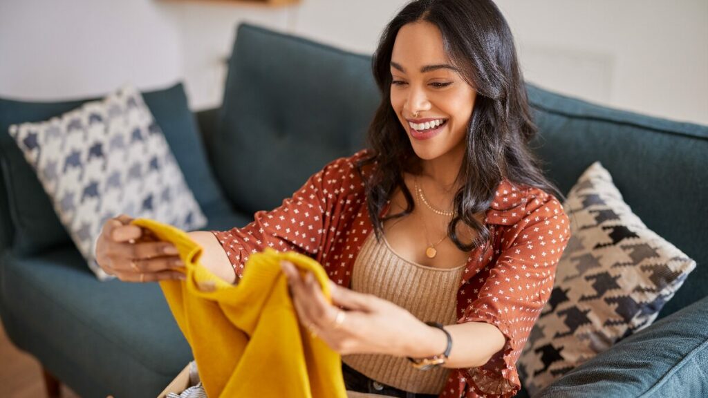 Shopper opening packages after having a positive customer experience.